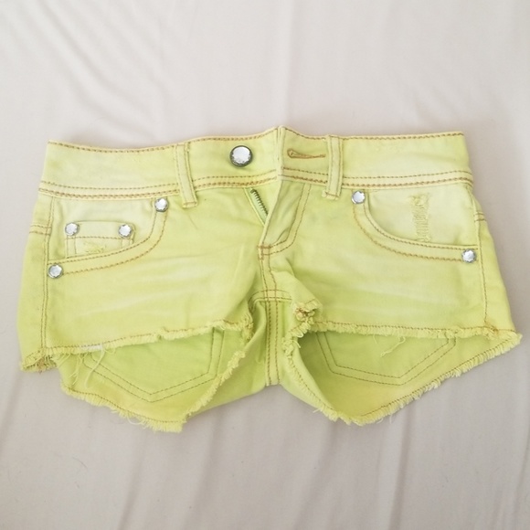 yellow distressed shorts